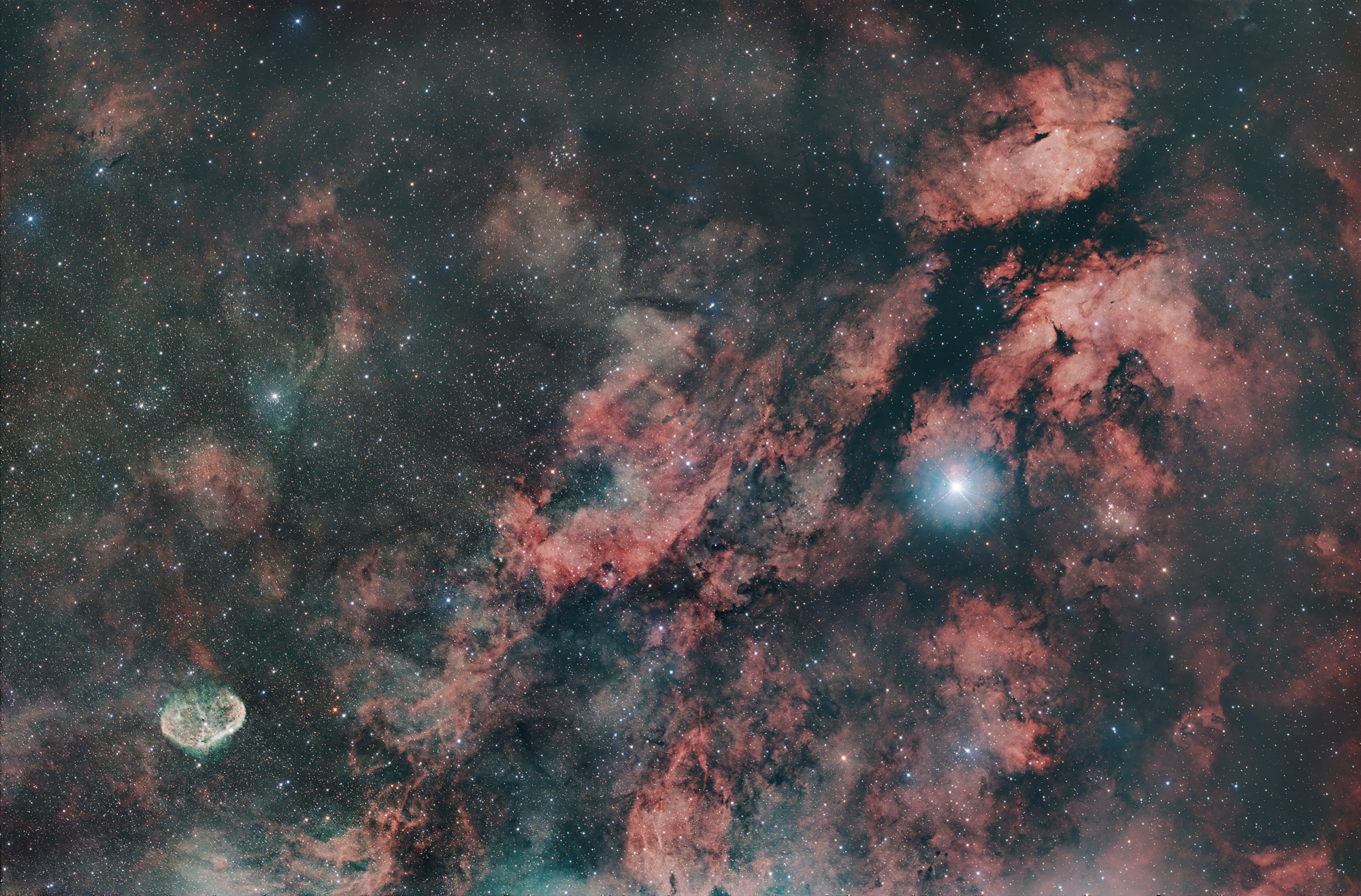 The Sadr region Sh2-108 in the Cygnus constellation is also known as the Gamma Cygni Nebula. The emission nebula surrounds the central star Sadr (γ Cygni) in the Cygnus constellation. The region includes the Butterfly Nebula, IC 1318, in the upper right of the image, and the Crescent Nebula, NGC6888 in the lower left of the image. The region also contains many dark nebulae.